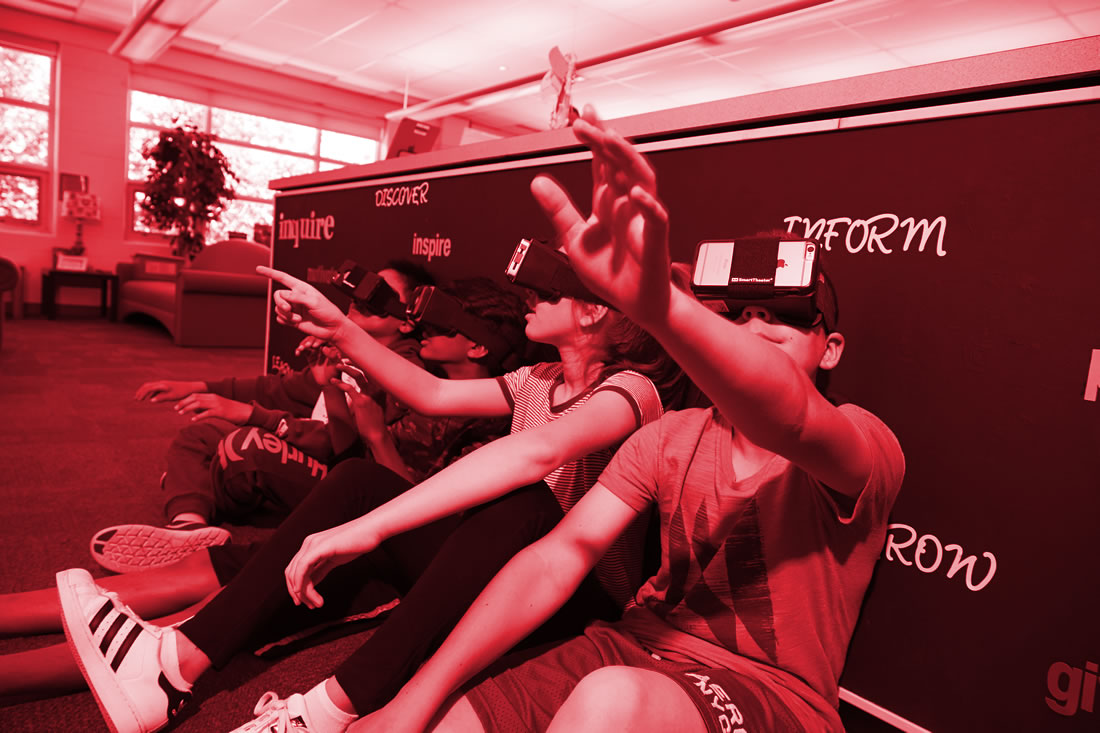 This is an image of students using VR glasses'.